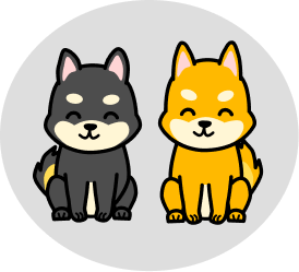 A yellow and a black shiba sitting up