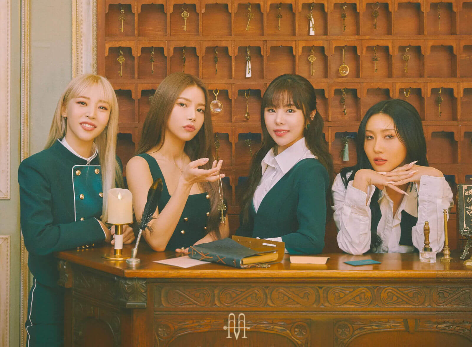 4 hotel staff at the front desk